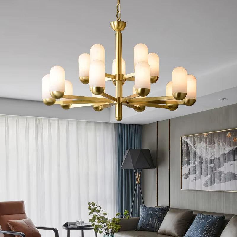 Modern Spanish marble chandelier with brass arms and frosted glass shades in living room