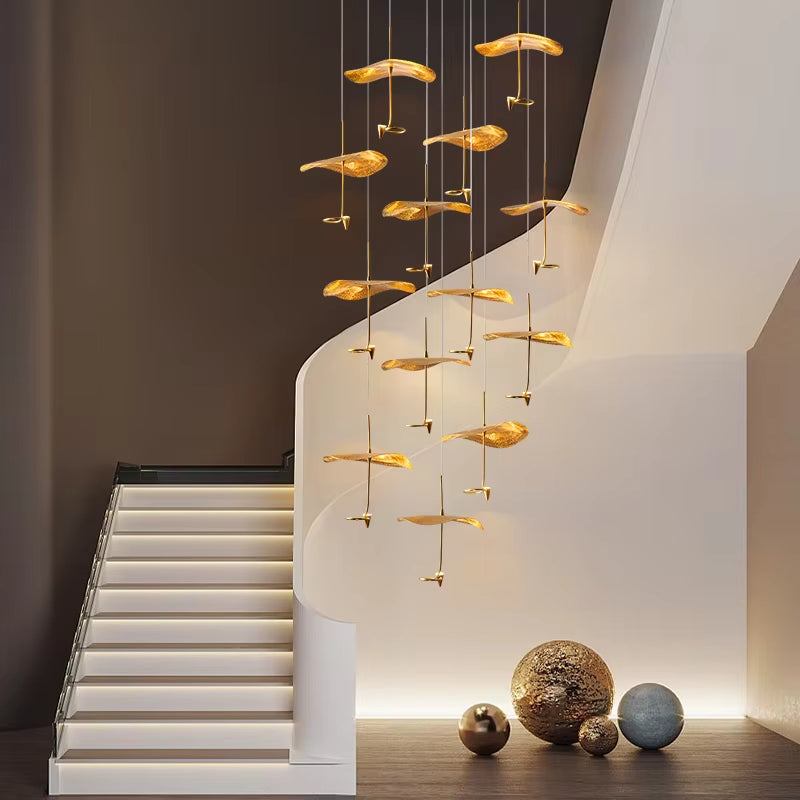Modern copper gold lotus stair chandelier with LED lights hanging over staircase