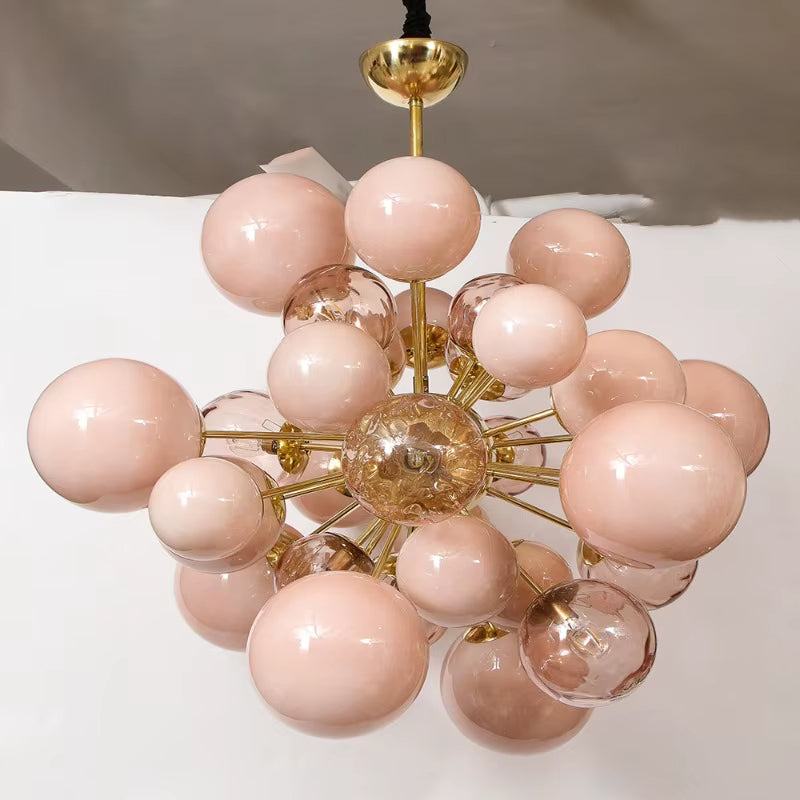 Modern pink bubble glass chandelier with metal frame and warm LED lighting