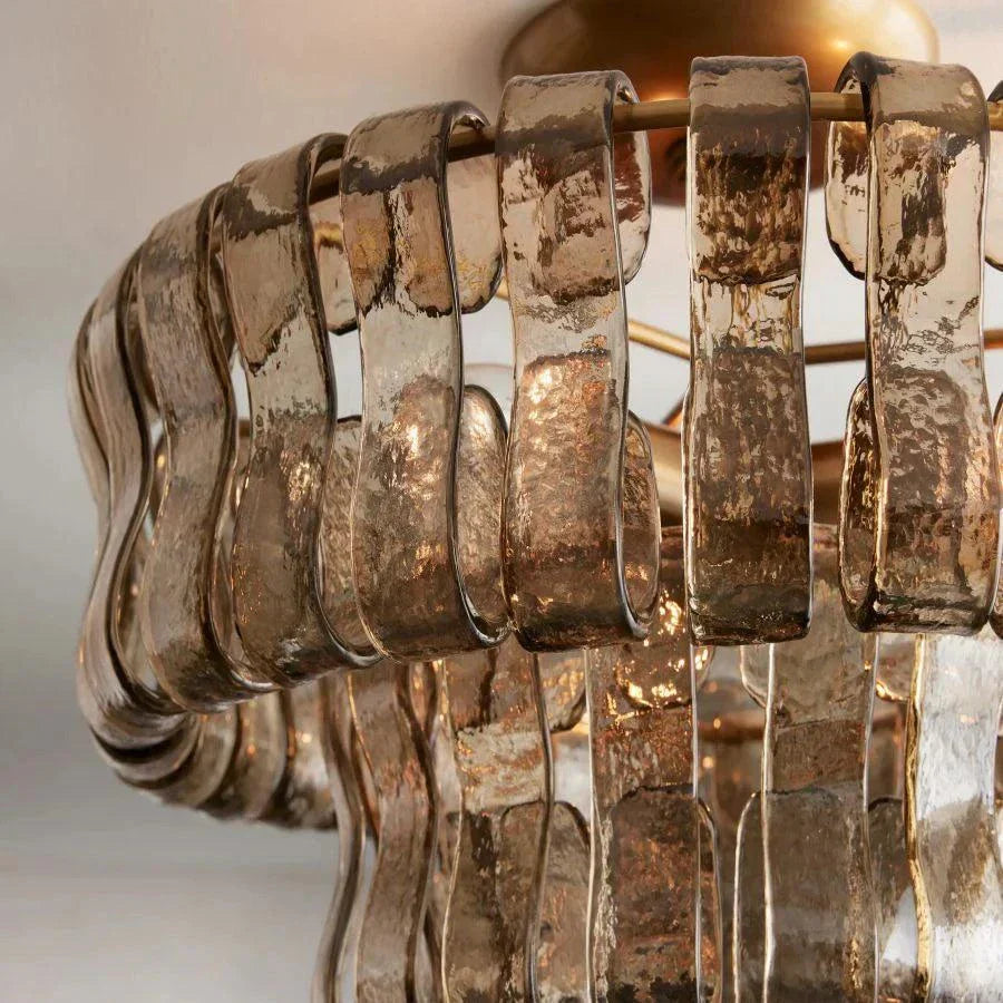 Ghiaccio Glass Flushmount with antique brass and matte black finish, metal and glass material, suitable for various rooms.