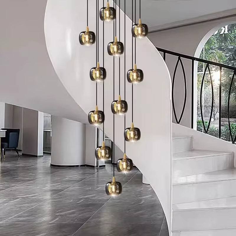 Modern bubble crystal lamp with multiple hanging lights in a spiral staircase setting