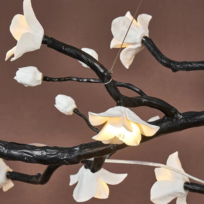 Brass and ceramic floral chandelier with golden-brown finish and warm lighting for modern interiors