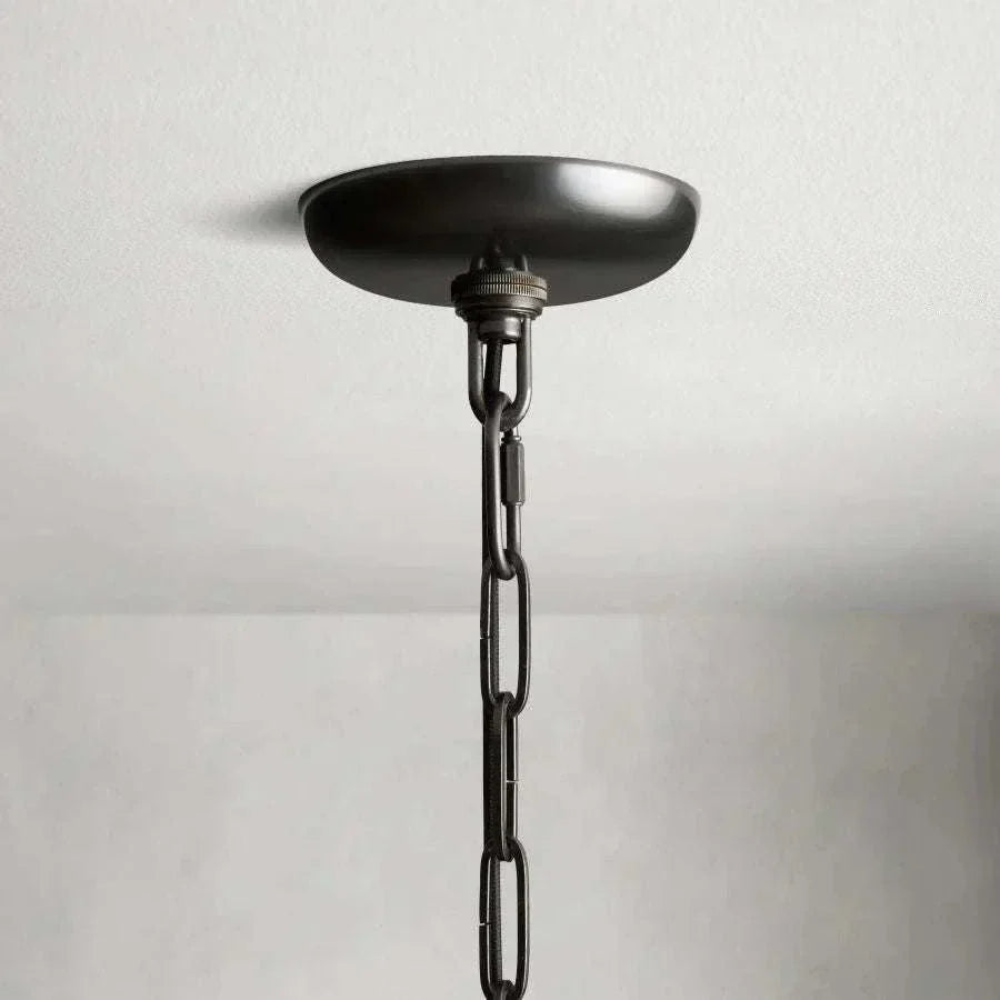 Ghiaccio Glass Round Chandelier with antique brass finish and metal chain canopy.