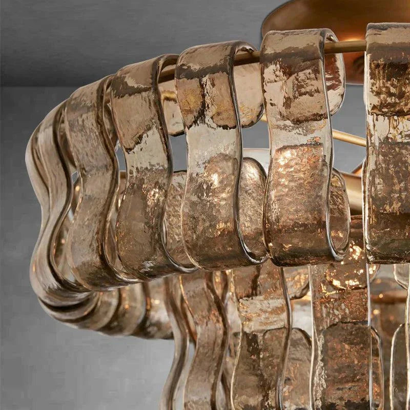 Ghiaccio Glass Flushmount with antique brass and matte black finish.