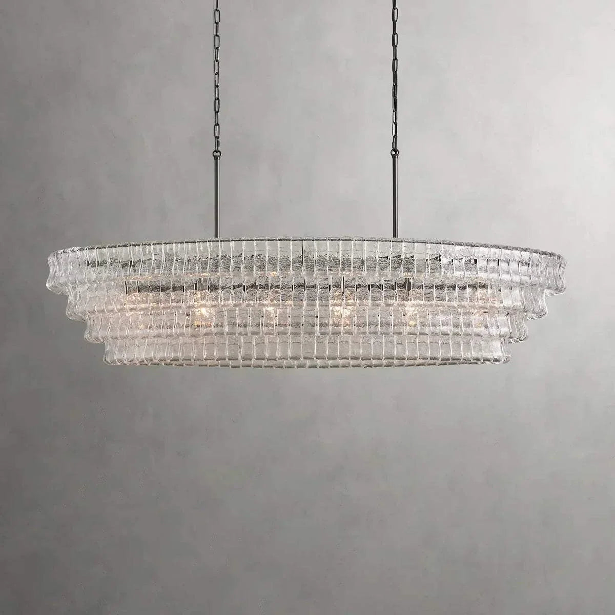 Ghiaccio Glass Oval Chandelier with metal and glass design, perfect for hotel or dining room lighting.