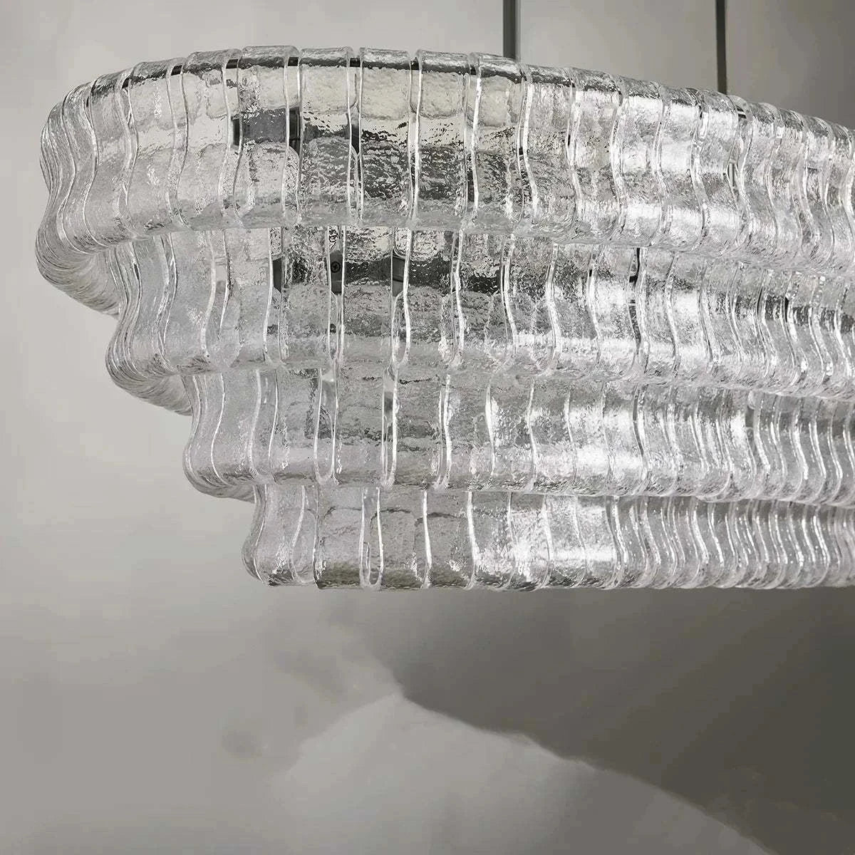 Ghiaccio Glass Oval Chandelier with metal and glass design, suitable for dining and living rooms.