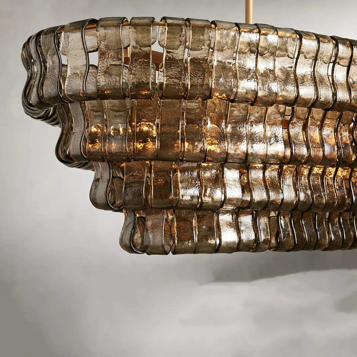 Ghiaccio Glass Oval Chandelier with metal frame, elegant for dining or living rooms.