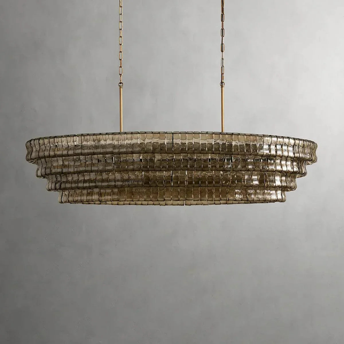 Ghiaccio Glass Oval Chandelier with metal frame, ideal for dining and living spaces.