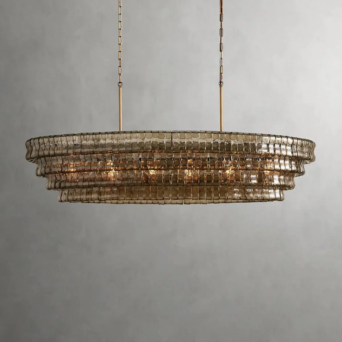 Ghiaccio Glass Oval Chandelier with metal and glass elements, suitable for living areas.