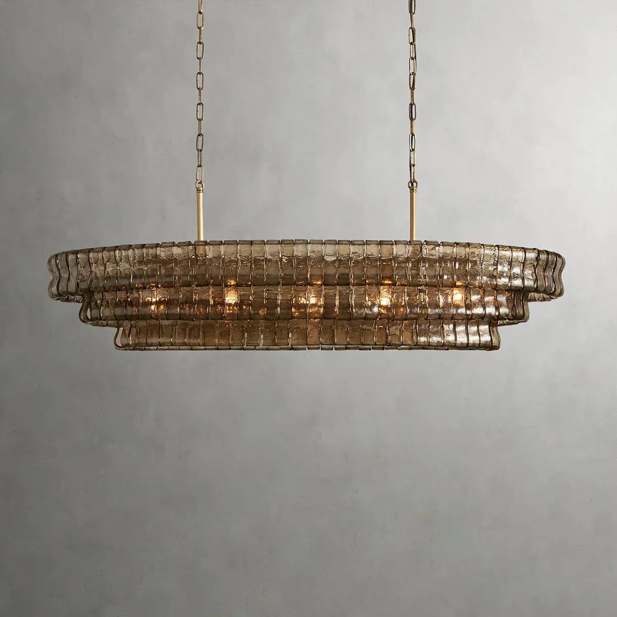 Ghiaccio Glass Oval Chandelier with metal and glass design, featuring adjustable hanging wire and multiple bulbs.