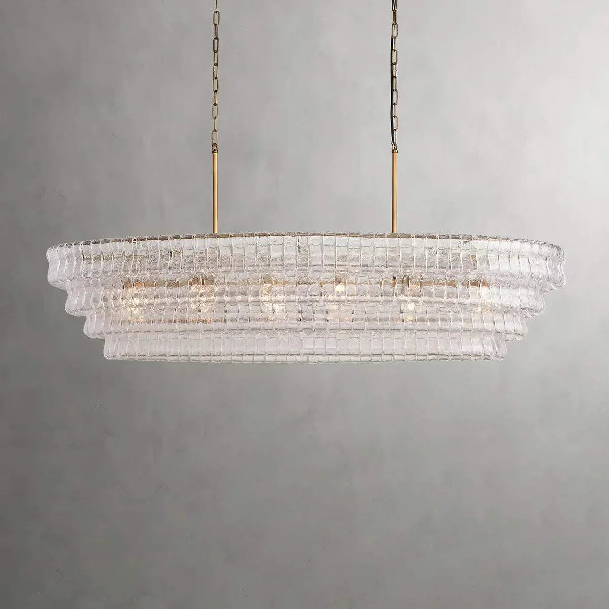Ghiaccio Glass Oval Chandelier with metal frame, ideal for dining and living rooms.