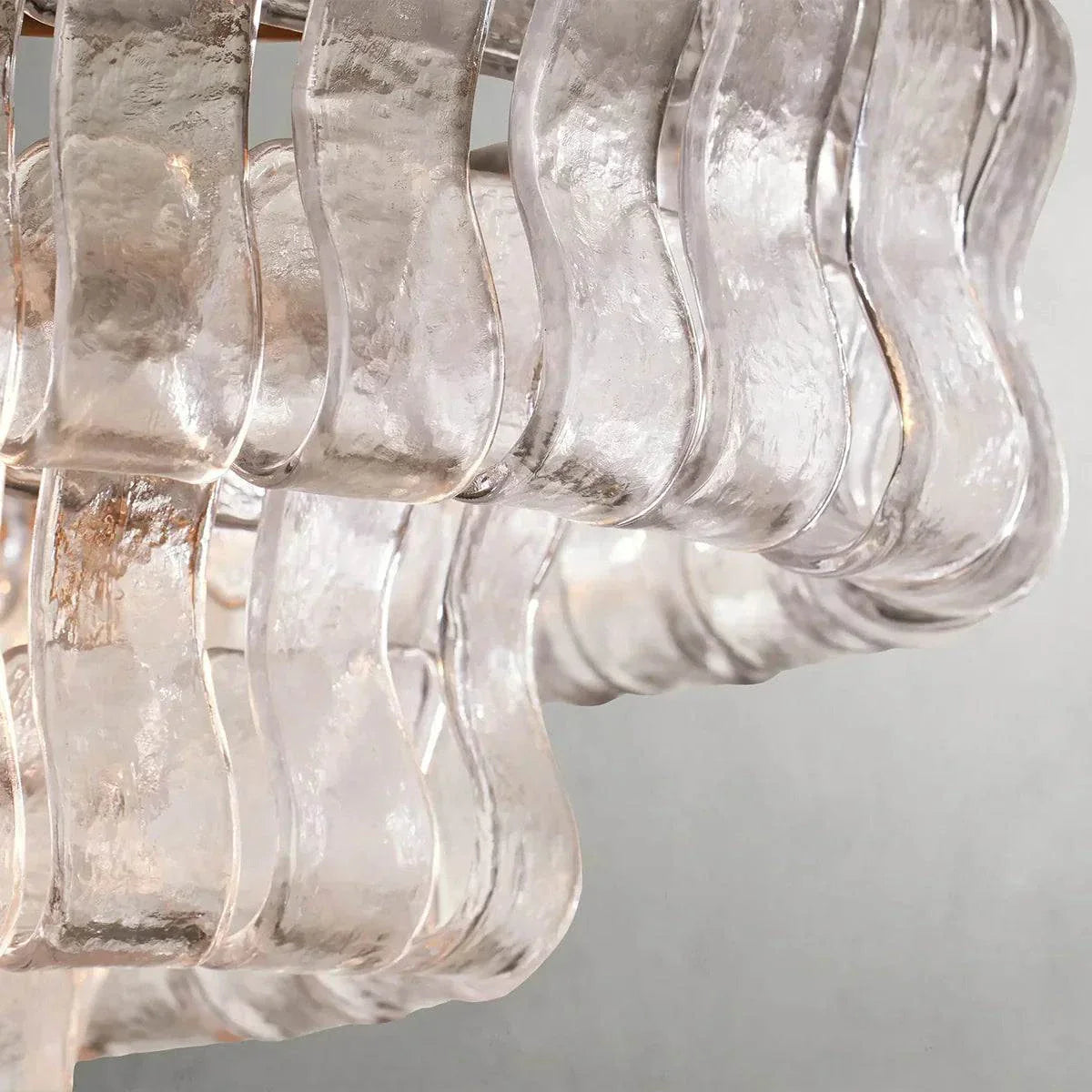 Ghiaccio Glass Oval Chandelier with textured glass detail and metal frame.