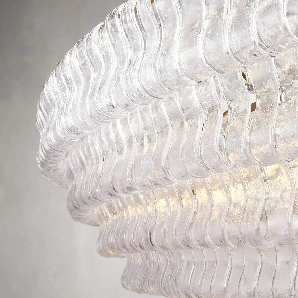 Ghiaccio Glass Oval Chandelier with textured glass design and robust metal framework.