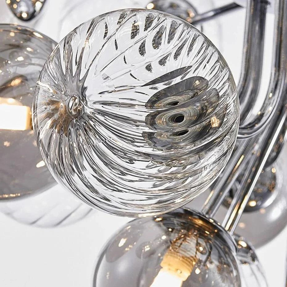 Modern glass bubble chandelier with chrome finish and multiple LED bulbs.
