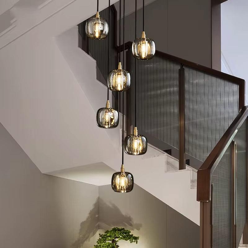 Modern bubble crystal lamp with multiple hanging glass globes illuminating staircase area