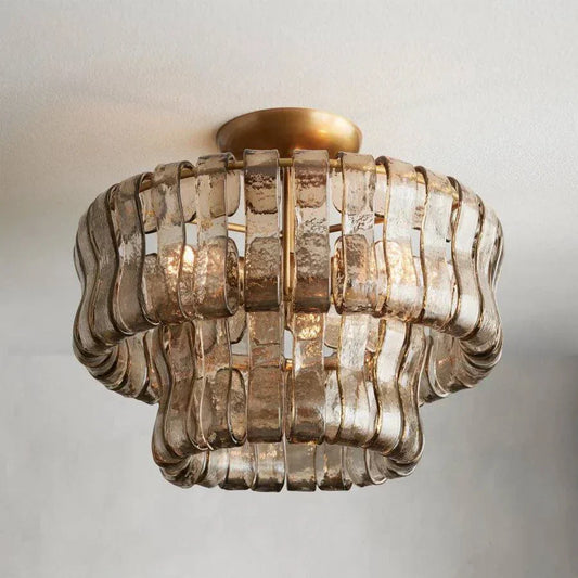 Ghiaccio Glass Flushmount with antique brass and matte black finish, featuring a wavy glass design and three E12 bulbs.