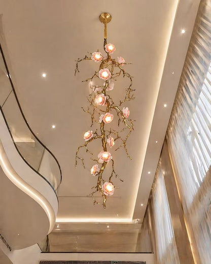 All-copper branch chandelier with ceramic flowers and warm light