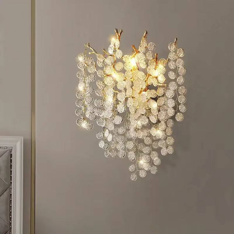 Celestial Collection Crystal Wall Sconce with gold and transparent crystals.