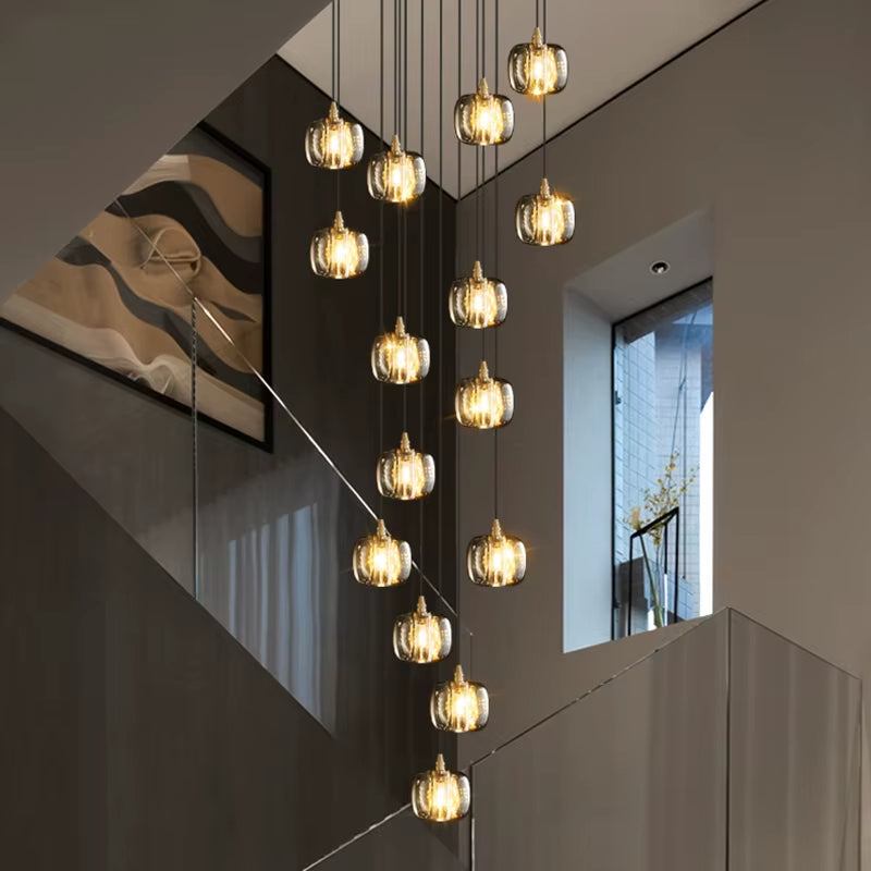 modern bubble crystal lamp chandelier with multiple adjustable hanging lights in stairwell