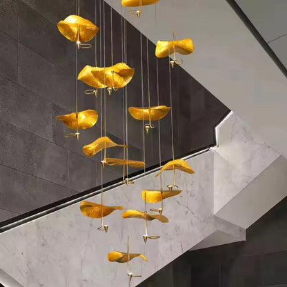 Copper gold lotus stair chandelier with LED lights hanging in modern interior