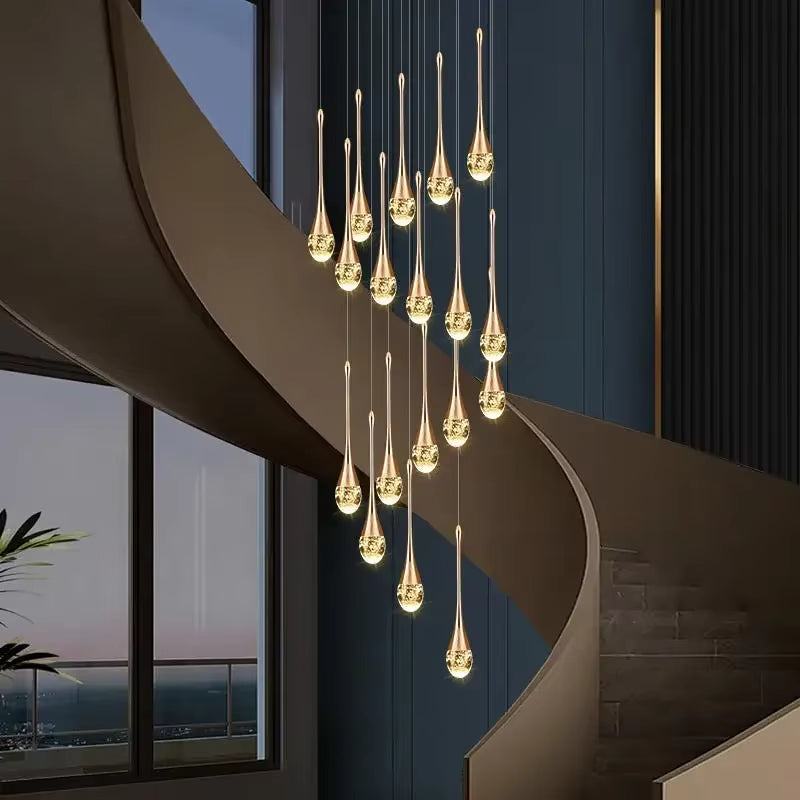 Modern gold stainless steel crystal long water drop chandelier with LED lights hanging in spiral staircase