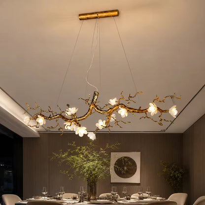 Magnolia Brass Branch Chandelier with antique gold finish and ceramic petals in modern minimalist style