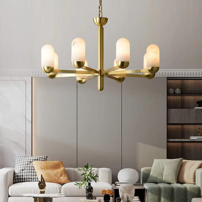 Spanish marble chandelier with brass frame and six illuminated frosted glass shades hanging in modern living room