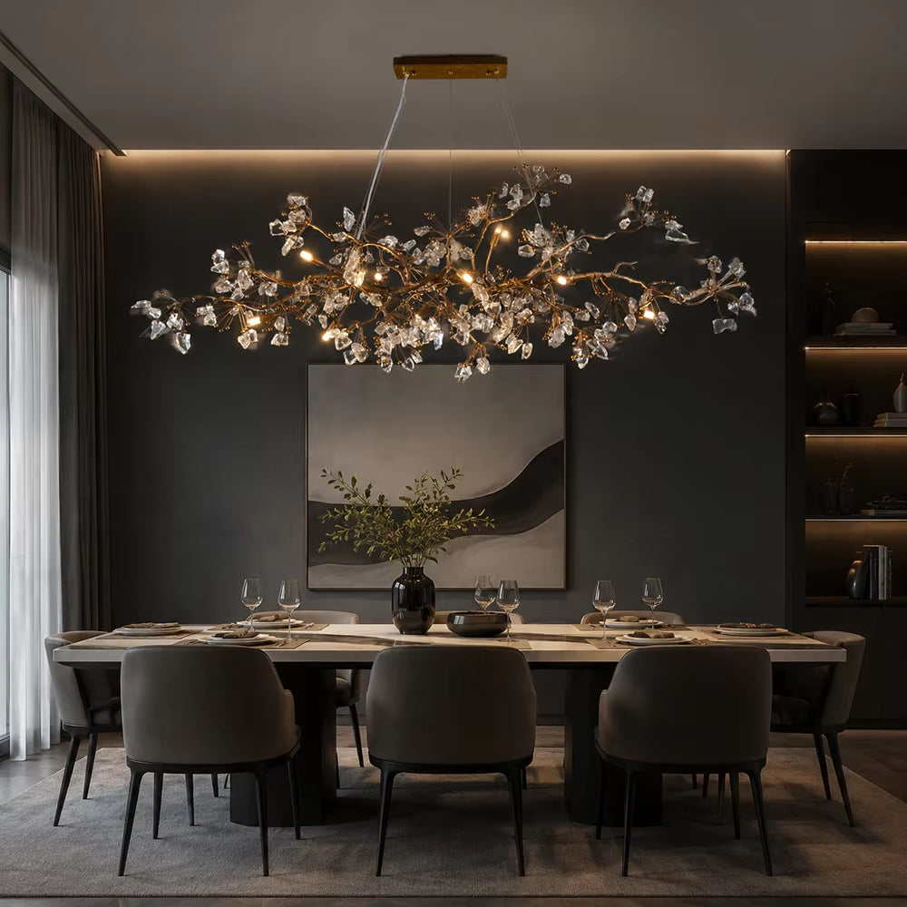 Handcrafted copper branch chandelier with crystal accents and warm light in antique gold finish