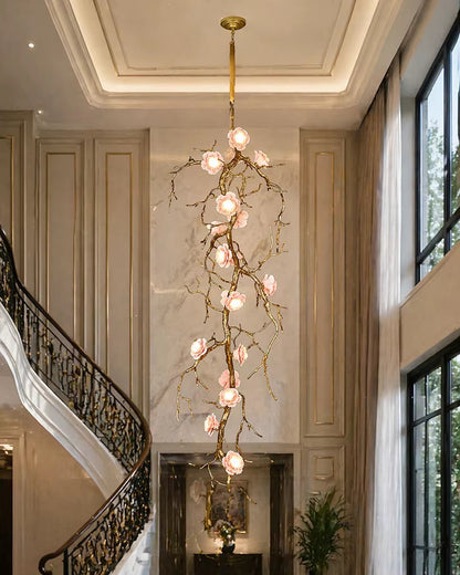 Elegant all-copper branch chandelier with ceramic flowers and warm light