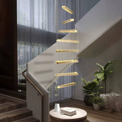 Modern spiral staircase LED chandelier with gold and glass design in living room setting