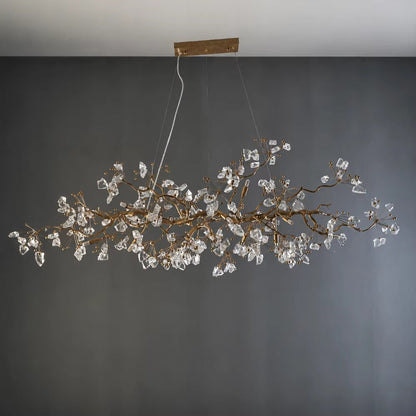 Handcrafted copper branch chandelier with crystal accents and warm light in antique gold finish