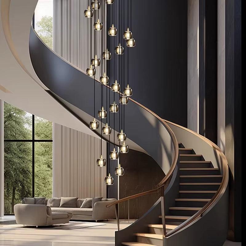 Modern bubble crystal lamp with multiple hanging glass bubbles, suspended in a spiral staircase living room setting