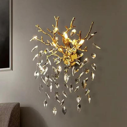 Celestial Collection Crystal Wall Sconce with gold and crystal design in modern style.