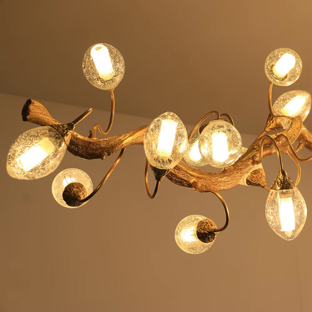 Brass and crystal ball branch chandelier with fruit-shaped crystal spheres and G9 light sources in golden brown finish