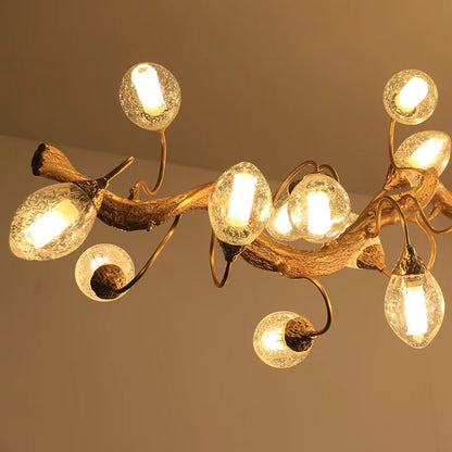 Brass and crystal ball branch chandelier with fruit-shaped crystal spheres and G9 light sources in golden brown finish