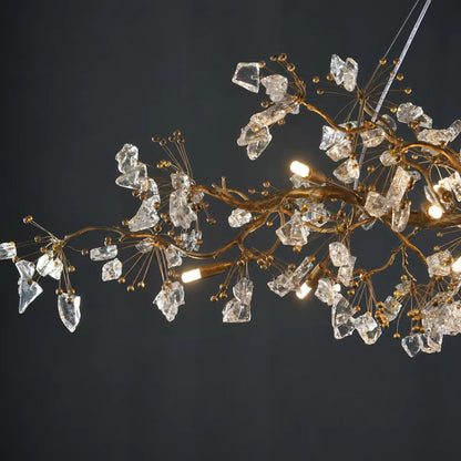 Handcrafted copper branch chandelier with crystal accents and warm light in antique gold finish