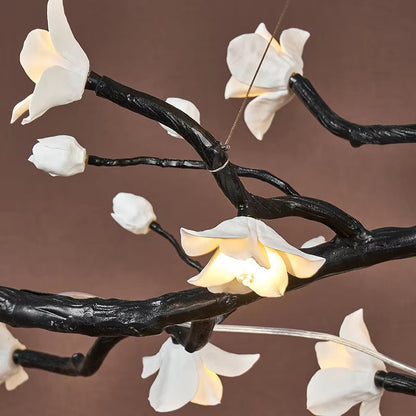 Brass and ceramic floral chandelier with golden-brown finish and warm lighting for modern interiors