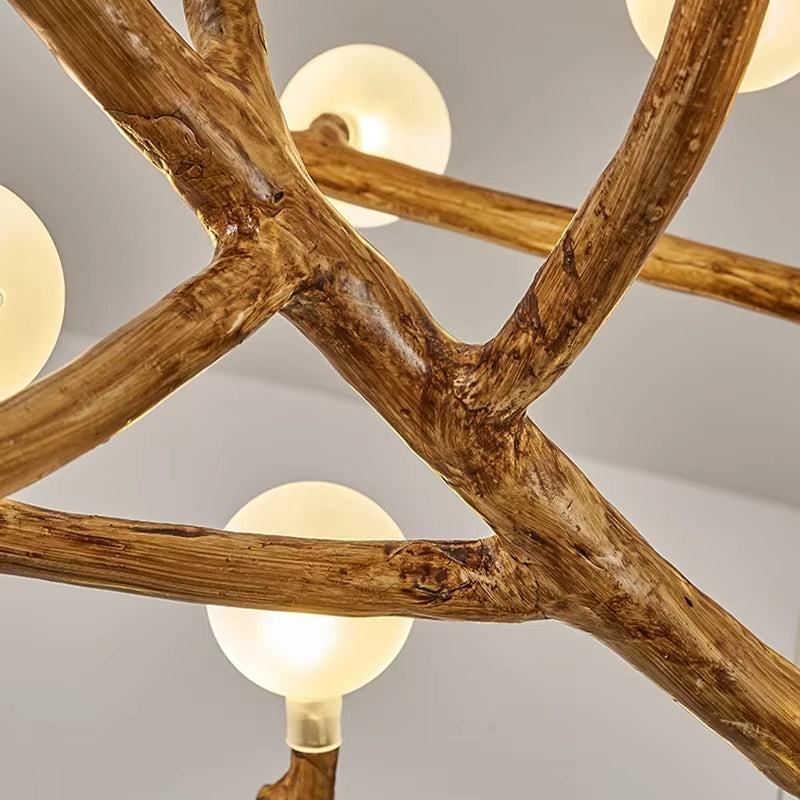 tree branch chandelier with 42 lights made of resin, metal, and frosted glass, large rustic design