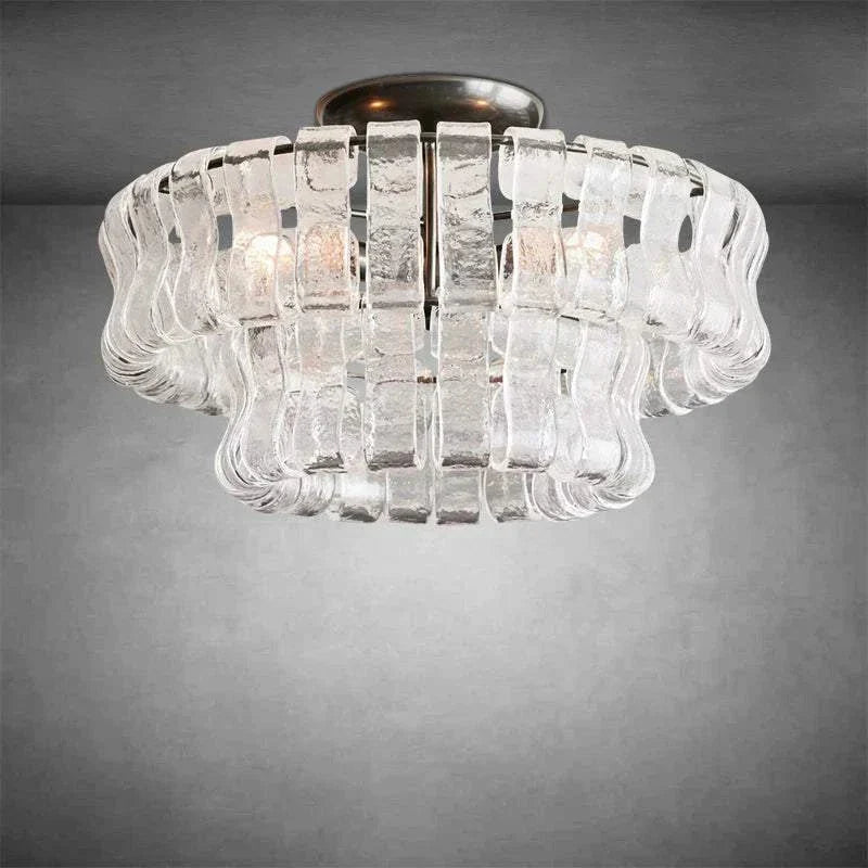 Ghiaccio Glass Flushmount light with antique brass and matte black finish.