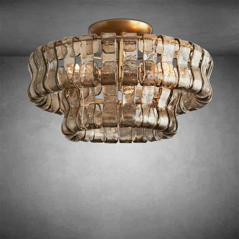 Ghiaccio Glass Flushmount with antique brass finish, metal and wavy glass design.