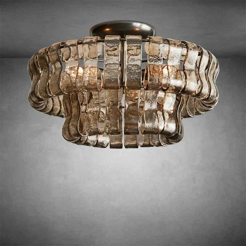 Ghiaccio Glass Flushmount with metal and glass design in antique brass finish.