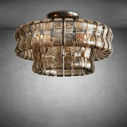 Ghiaccio Glass Flushmount with metal and glass design in antique brass finish.