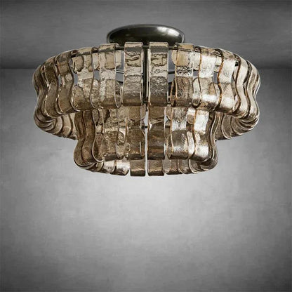 Ghiaccio Glass Flushmount with antique brass and matte black finish.