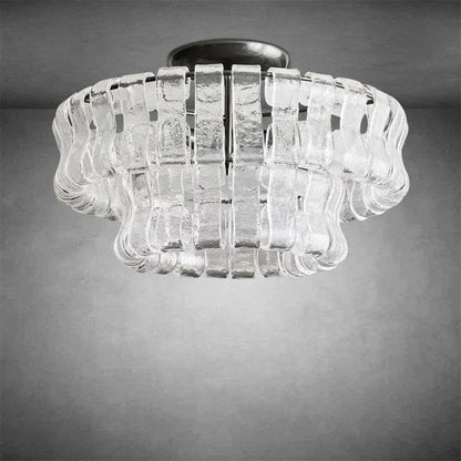 Ghiaccio Glass Flushmount with antique brass finish and dimmable E12 bulbs.