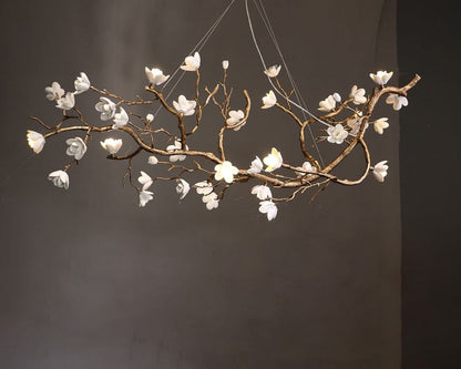 Elegant brass ceramic chandelier with floral design, ideal for modern interiors.