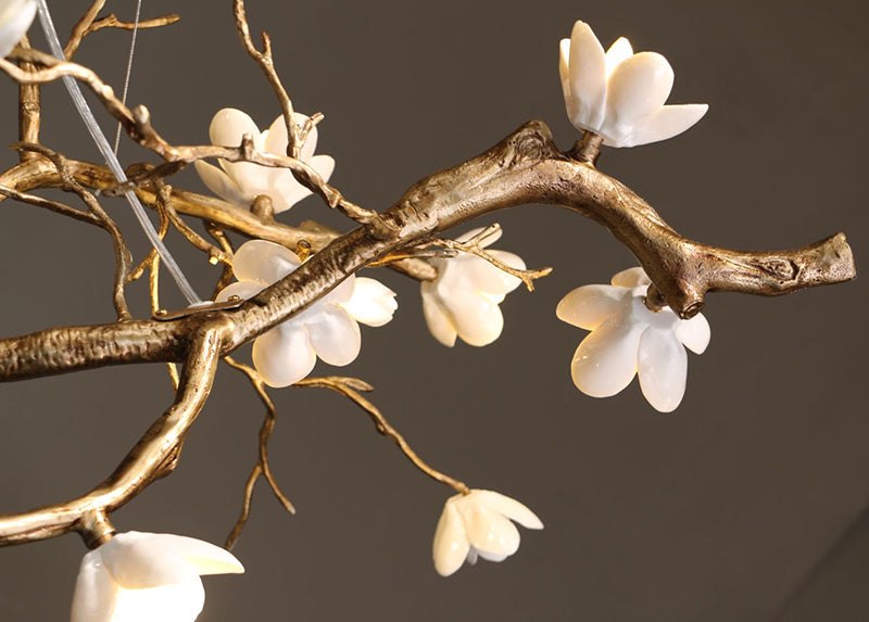 Brass ceramic chandelier with floral design features detailed craftsmanship.