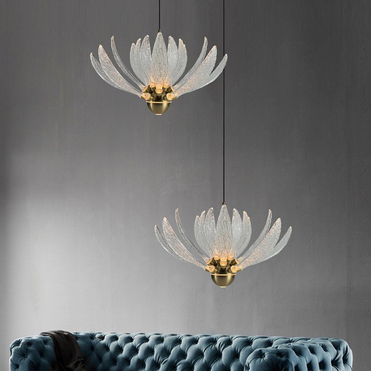 Modern Petal Chandelier with metal and glass petals and LED bulbs hanging over sofa