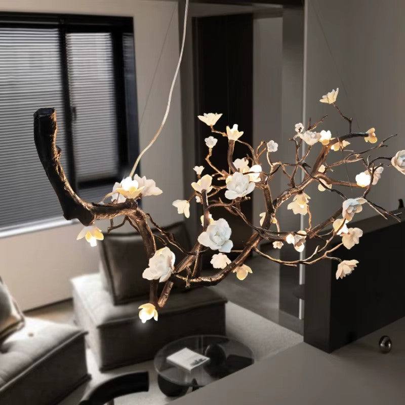 Modern brass ceramic chandelier with floral design, suitable for living rooms and high-end spaces.