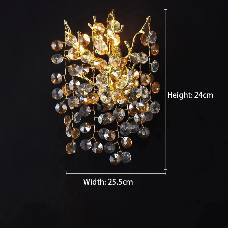 Modern gold and crystal wall sconce from the Celestial Collection with LED bulb.